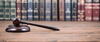 books and a gavel on a wooden table